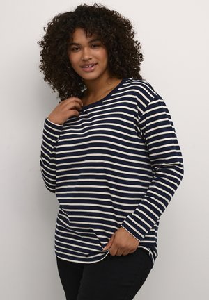 Navy and cream striped long-sleeve top, round neckline, soft fabric, relaxed fit, featuring a slightly curved hem and cuffed sleeves.