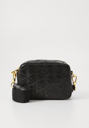 Black rectangular crossbody bag with embossed geometric pattern. Features gold hardware and a detachable fabric strap. Smooth texture.