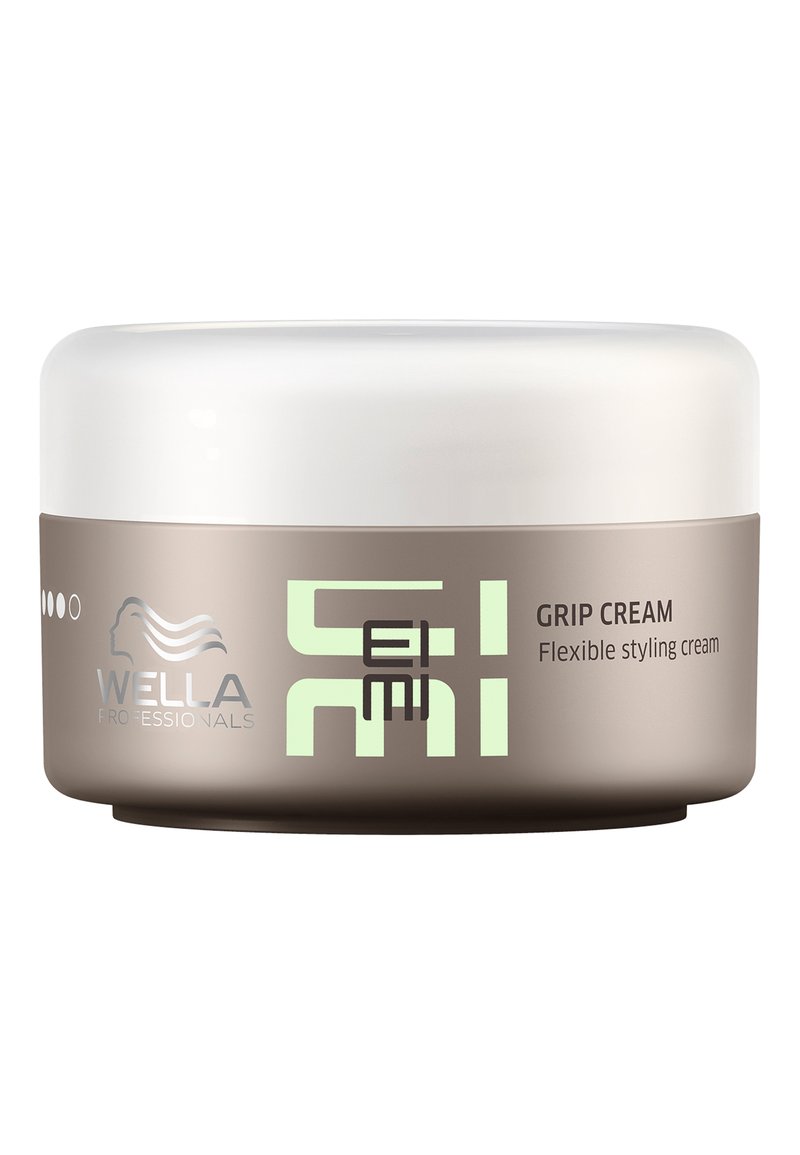 Wella Professionals Grip Cream in einem runden, beigefarbenen Behälter mit einem weißen Deckel. Das Etikett zeigt grünen Text und ein graues Logo. Flexible Styling-Creme.