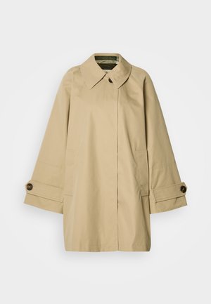 Beeži värviga trentšmantel, millel on klassikaline krae, üle suurendatud varrukad, nööbitavad mansetid ja kaks eesmist taskut. Valmistatud siledast, veekindlast materjalist.