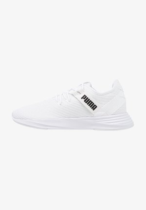 White athletic shoes with a textured mesh upper, flat laces, and a logo on the side. Designed for comfort with a cushioned sole.