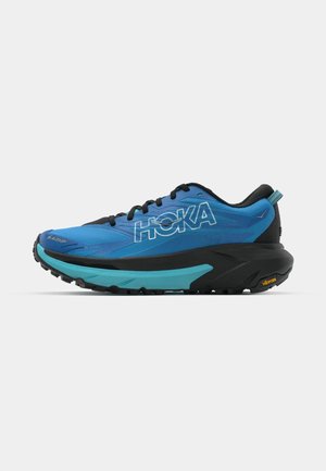 Blue running shoe with black accents, featuring a thick sole, textured upper, and prominent logo. Vibram branding on the outsole.
