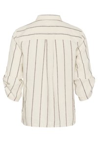 Chemise beige à manches longues avec fines rayures verticales marron, manches retroussées et empiècement au niveau du haut du dos.
