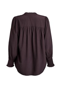 Brun bluse med rynket halsudskæring, lange pufærmer og rynkede manchetter med et løst, flydende design. Glat stoftekstur.