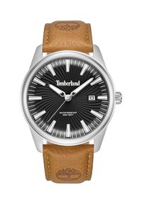 Timberland pulkstenis ar nerūsējošā tērauda korpusu, melnu saules staru ciparnīcu, baltām stundu atzīmēm un brūnu ādas siksniņu ar logo iedzīšanu. Ūdensizturīgs līdz 50m.