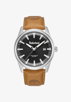 Timberland pulkstenis ar nerūsējošā tērauda korpusu, melnu saules staru ciparnīcu, baltām stundu atzīmēm un brūnu ādas siksniņu ar logo iedzīšanu. Ūdensizturīgs līdz 50m.