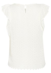 Blouse blanche avec un design en œillets, des manches volantées et un dos en forme de trou de serrure. Caractéristiques d'un ourlet festonné et de motifs circulaires complexes.