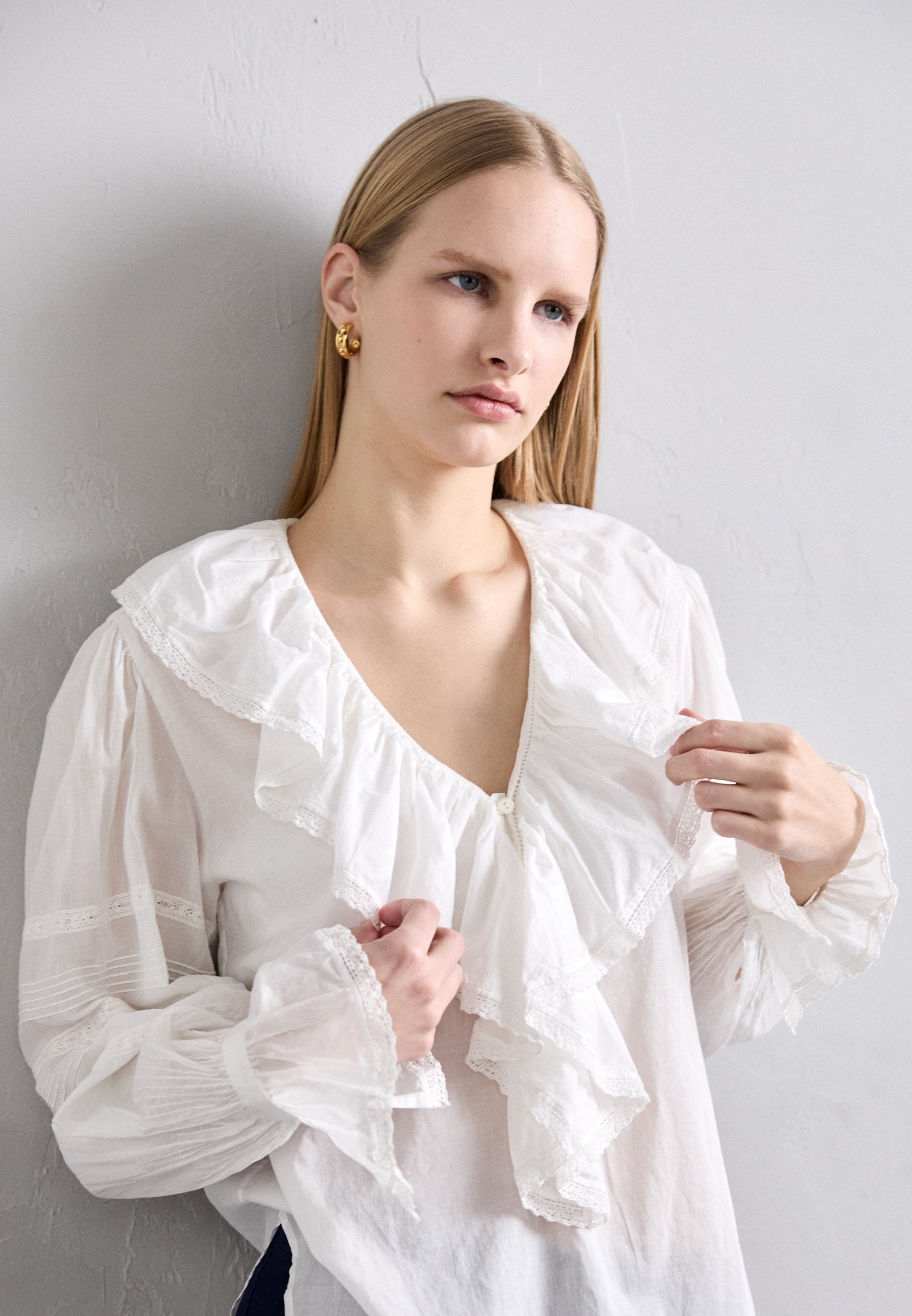 white top ruffle sleeves