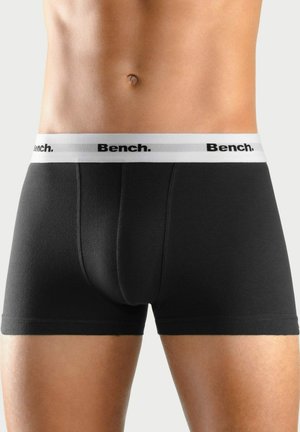 Schwarze Baumwoll-B boxerbriefs mit einem weißen Bund, der ein schwarzes Logo zeigt. Glatte Textur und enganliegendes Design, geeignet für den täglichen Gebrauch.
