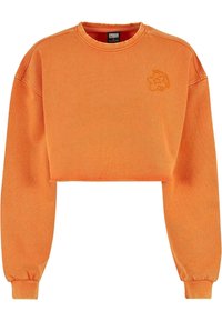 Sweatshirt orange court à manches longues, col rond, poignets côtelés et petit logo de fleur brodé sur le côté gauche de la poitrine.