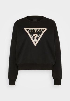 Black sweatshirt with a cropped design, featuring a triangular logo in beige with metallic accents. Ribbed cuffs and hem, made of soft fabric.