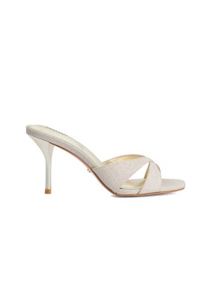 Beige high-heeled mule sandal with crisscross fabric straps and slim stiletto heel on a white background.