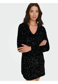 Czarna sukienka z cekinami, z dekoltem w serek, długimi rękawami i teksturowaną powierzchnią, ozdobiona błyszczącymi cekinami, które nadają jej refleksyjny detal.