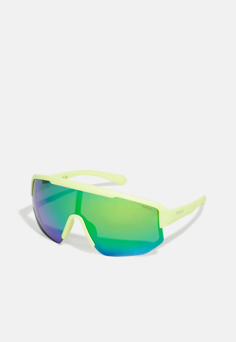 Yellow-green sunglasses with a large, wraparound lens featuring a gradient from blue to green. Sleek design with straight arms.