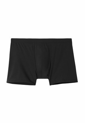 Boxers negros hechos de una tela suave. Presentan un saco contorneado y una cinturilla elástica y suave. Sin patrones o acentos visibles.