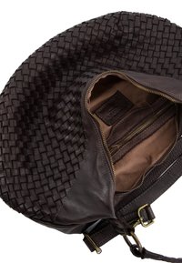 Round woven leather bag in dark brown, featuring a smooth leather rim, zippered interior pocket, and soft lining. Detailed stitching accents visible.