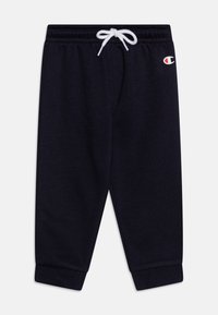 Pantaloni della tuta blu scuro realizzati in morbido tessuto, con vita regolabile tramite cordino, polsini a costine e un piccolo logo sulla gamba.