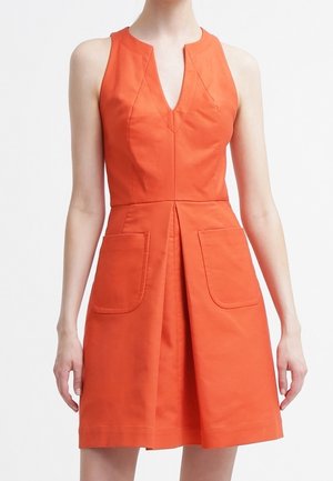 Orange sleeveless dress with a V-neck, featuring a fitted bodice, two front pockets, and a flared skirt. Made from a smooth fabric.