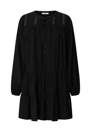 Black long-sleeve dress with a rounded neckline, tie detail, subtle pleats, and a tiered hem. Soft textured fabric with gold accents.