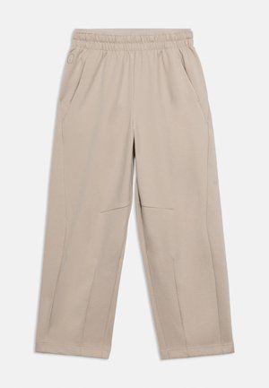 Pantalones beige de pierna ancha con cintura elástica y bolsillos laterales, diseñados para un uso casual.