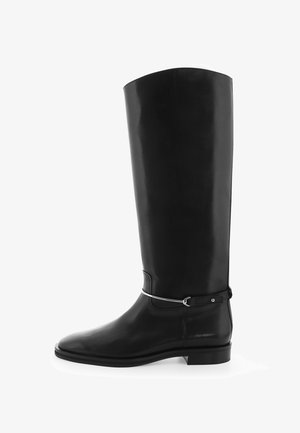 Black leather knee-high boot with a smooth finish, rounded toe, and a silver buckle accent on the ankle. Features a low, flat heel.