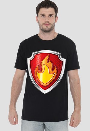 Black t-shirt featuring a large, red shield graphic with a yellow flame design in the center. Short sleeves, crew neckline, casual fit.
