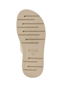 Suola di scarpa in gomma beige con scanalature e rilievi testurizzati. Presenta il logo del produttore e il numero di taglia, progettata per offrire aderenza e trazione.