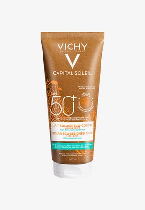 Sunscreen tube in a brown and turquoise design, labeled "SPF 50+" and "Eco-Designed Milk." Contains 200 ml, features waterproof and hydrating details.