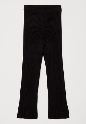 Μαύρες ριβέ leggings με καμπάνα και ελαστική μέση, με υφή που προσφέρει επιπλέον άνεση και ελαστικότητα.