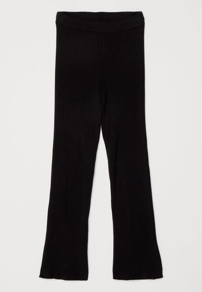 Black ribbed leggings with a flared hem and an elastic waistband, featuring a textured fabric for added comfort and stretch.