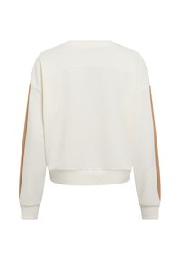 Cream sweatshirt with long sleeves, featuring tan side panels, ribbed cuffs, and a cropped hem. Soft texture, minimalistic design.