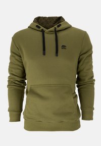 Olivegrüne Kapuzenjacke aus weichem Stoff. Mit einer Vordertasche, Kordelzugkapuze und schwarzem Logo auf der Brust. Innen hat sie ein geometrisches Muster.