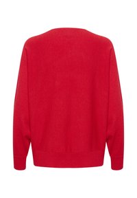 Punainen villapaita, rento malli, pehmeä rakenne, leveät hihat, ribbaudet hihansuut ja helma. Sujuva kangas ilman näkyviä kuvioita tai koristeita.