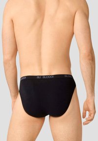 Slip da uomo neri con elastico Sloggi, tessuto liscio, design minimalista e vestibilità aderente.