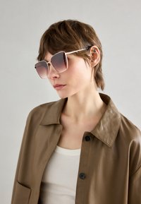 Lunettes de soleil - gold-coloured