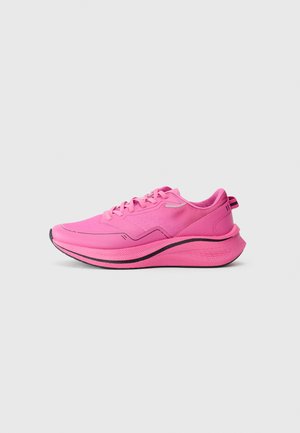 Bright pink athletic sneaker with thick sole, black outsole detail, and lace-up design, shown in side profile on plain light background.