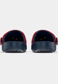 Navy blue clogs with a textured surface, red accents around the back, and adjustable straps. Open heel design for easy wear.