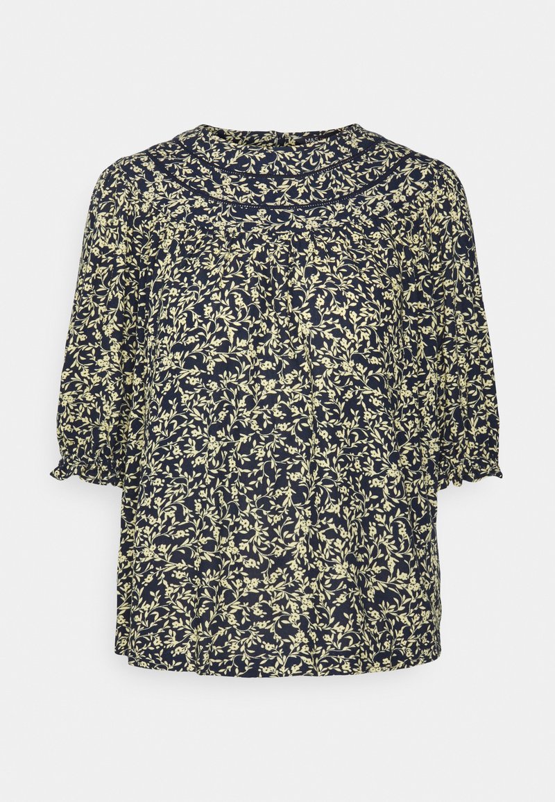 Blusa azul-marinho com padrão floral em creme, decote redondo e mangas curtas com punhos franzidos. Tecido leve.