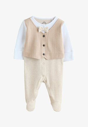 Completo beige per bambino composto da un gilet strutturato con bottoni e papillon, abbinato a una parte inferiore liscia e morbida, design con piedini.