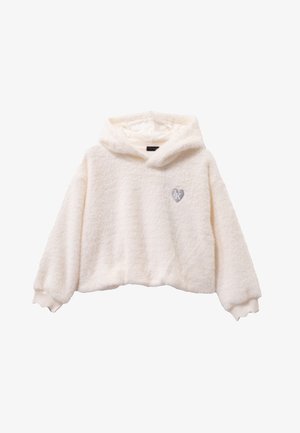 Soft cream-colored fuzzy hoodie with long sleeves, ribbed cuffs, and small silver heart emblem on left chest.