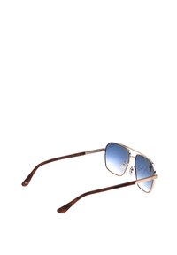 Lunettes de soleil à monture carrée avec monture métallique dorée, verres dégradés bleus et branches incurvées marron foncé sur fond blanc.