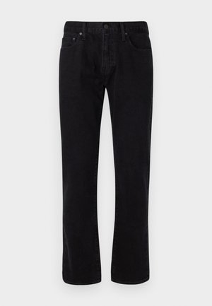 Juodos džinsinės kelnės su tiesia kojų forma, turinčios penkis kišenių, užsegimas mygtuku ir subtilūs siuvimo detalės. Lygus paviršius.