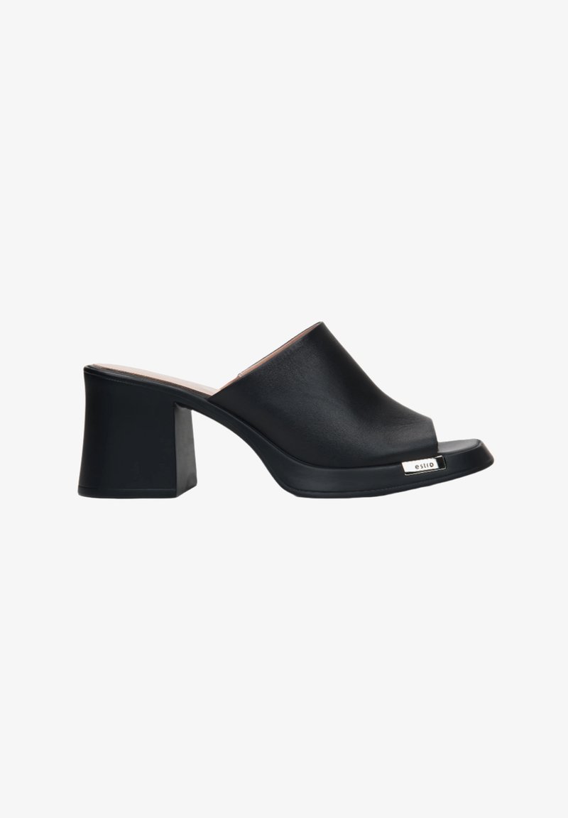 Black block-heel mules with a smooth, glossy surface, open toe design, and a subtle metallic logo accent on the side.