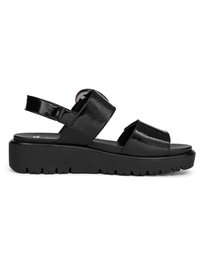 Black patent leather sandal with two wide straps, adjustable ankle strap with buckle, and thick ridged sole for added height and grip.