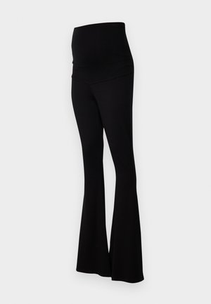 Stieglitz STIEG FLARED - Leggings - Trousers - black