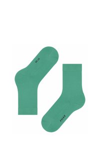 Grüne Baumwollsocken bis zum Knöchel mit glattem Material, gerippten Bündchen und Druck auf der Sohle. Eine Socke ist schräg gelegt, um ihre Form zu zeigen.