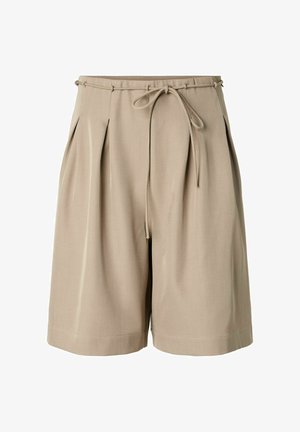 Beežid põlveni ulatuvad lühikesed püksid esipoolsete liistude ning õhukese vööga, mis on vöökohal kikilipsuks seotud.