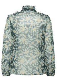 Blusa transparente de manga larga con cuello alto con volantes, con un patrón de enredadera floral en verde y beige sobre tela translúcida.