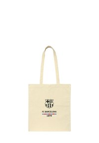 Kremowa torba na ramię z logo FC Barcelona, z napisem "FC BARCELONA" oraz "1899" poniżej emblematu.