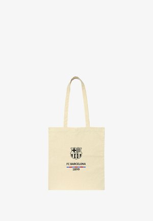 Borsa a tracolla color crema con il logo del FC Barcelona, con la scritta "FC BARCELONA" e "1899" sotto l'emblema.